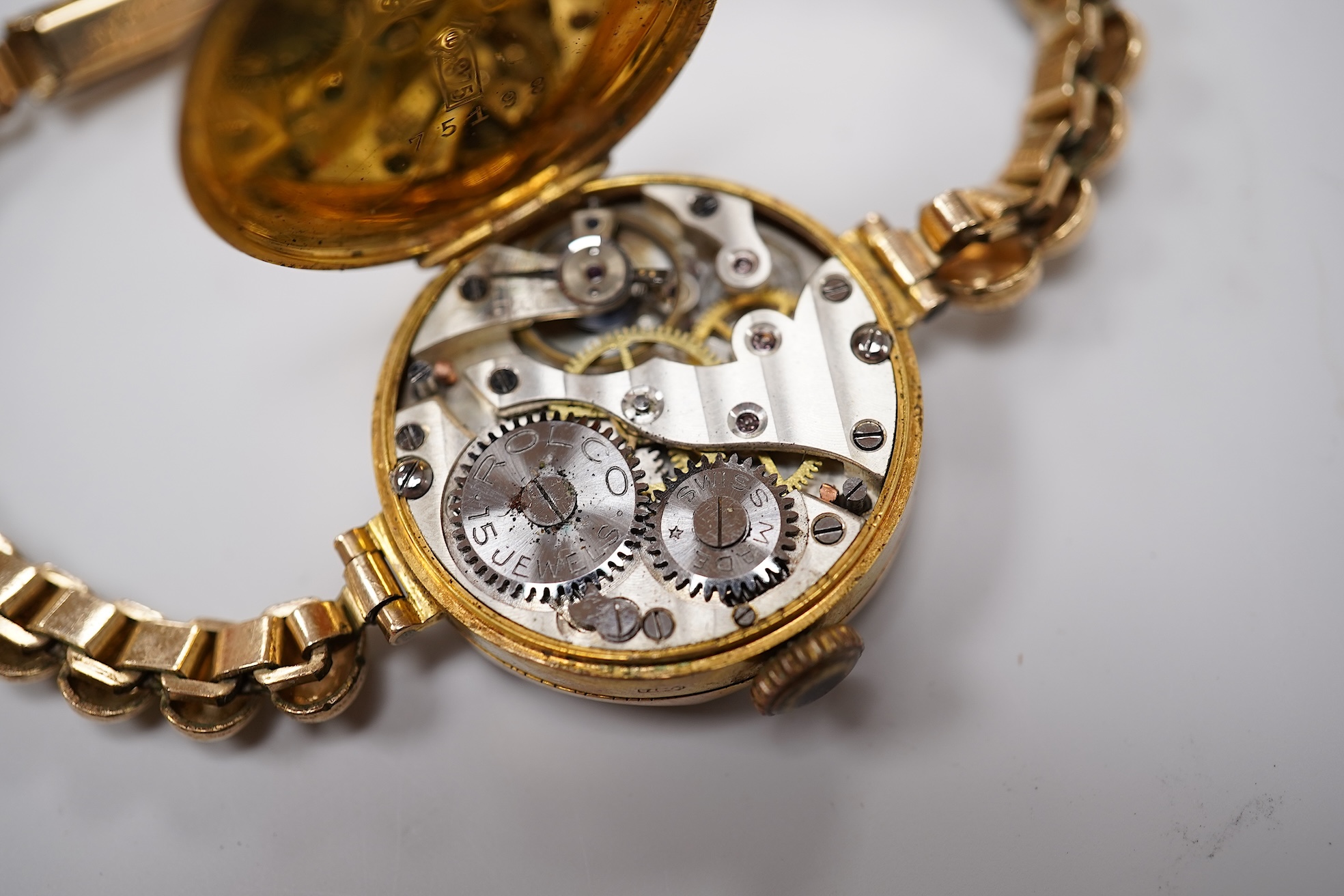 A lady's 9ct Omega manual wind wrist watch, on an associated leather strap, case diameter 20mm, together with a lady's early 20th century 9ct gold Rolco manual wind wrist watch, on a rolled gold bracelet.